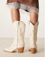 embroidered western knee boots in cream