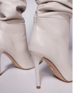 Schmooze pointed stiletto heel knee boots in cream