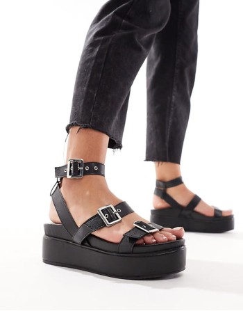 Trombone chunky buckle detail flatforms in black