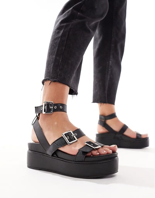 Trombone chunky buckle detail flatforms in black